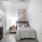bedroom with grey bedding and dresser